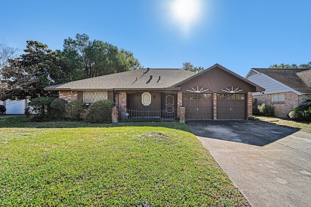 ranch-style house featuring brick siding, a shingled roof, a front yard, driveway, and an attached garage