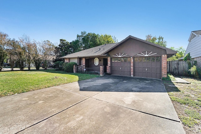 ranch-style home featuring a garage and a front lawn