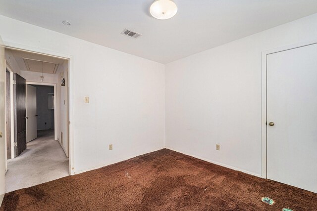 spare room featuring carpet floors