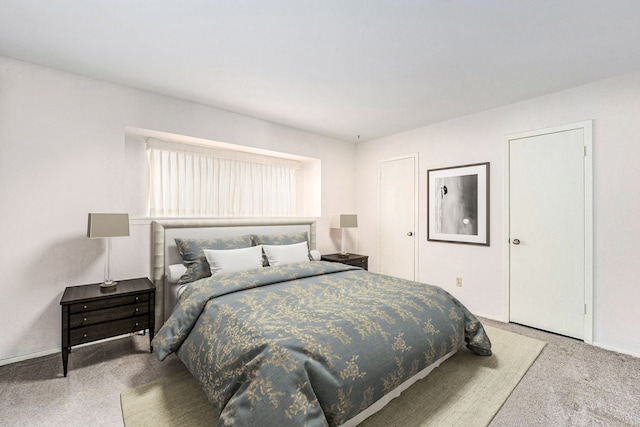 bedroom featuring baseboards and carpet floors