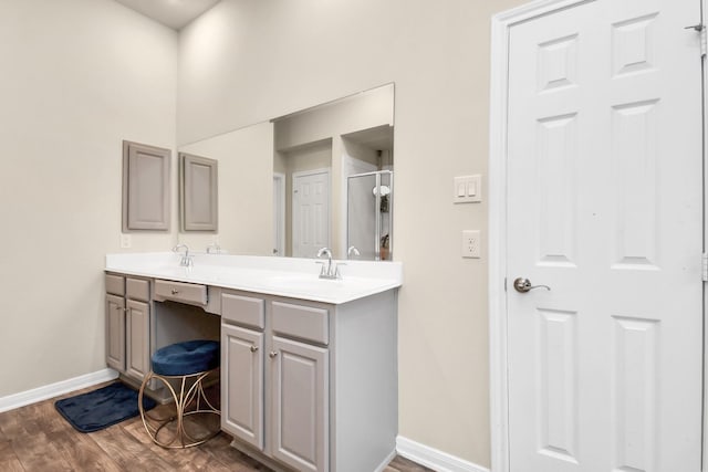 bathroom with wood-type flooring and vanity