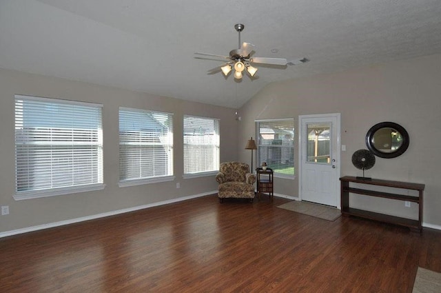 unfurnished room with ceiling fan, dark hardwood / wood-style flooring, and lofted ceiling