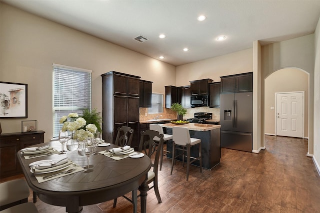 dining space featuring dark wood-type flooring