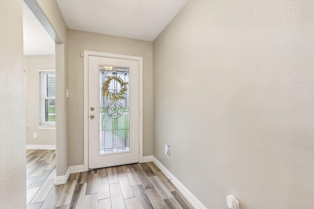 doorway to outside with light hardwood / wood-style floors