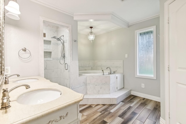 bathroom with vanity, wood-type flooring, crown molding, and plus walk in shower