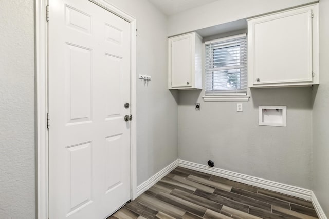 clothes washing area with electric dryer hookup, cabinets, dark wood-type flooring, and hookup for a washing machine