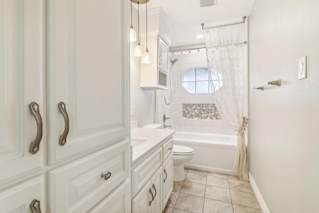 full bathroom featuring toilet, tile patterned floors, vanity, and shower / tub combo with curtain