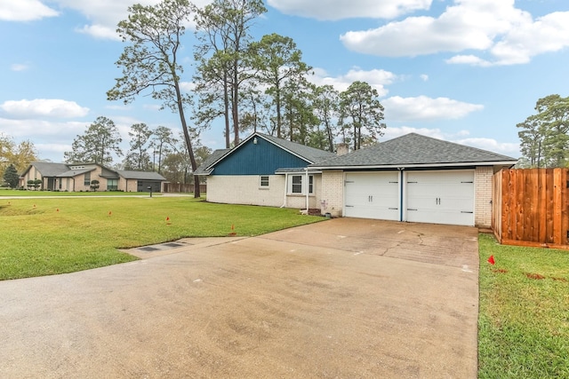 view of front of home with a garage and a front yard