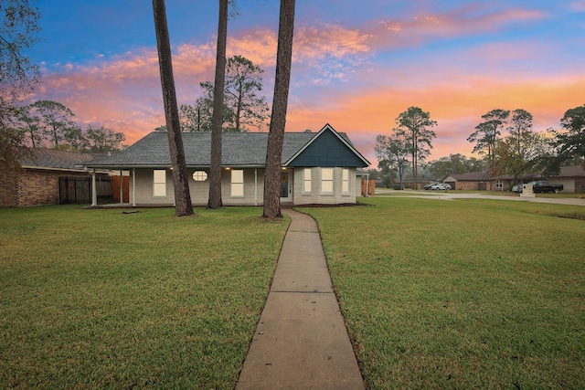 view of front of house with a lawn