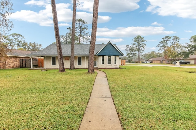 single story home with a front yard