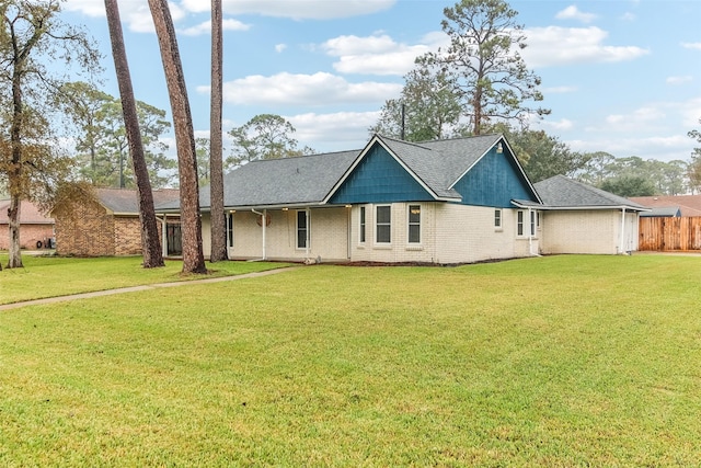 ranch-style house with a front lawn