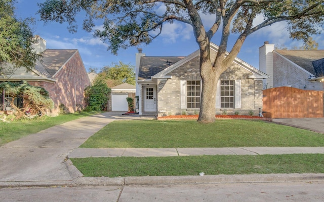 view of front of home featuring a front yard and a garage