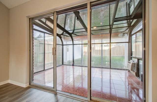 entryway featuring hardwood / wood-style floors and a wealth of natural light