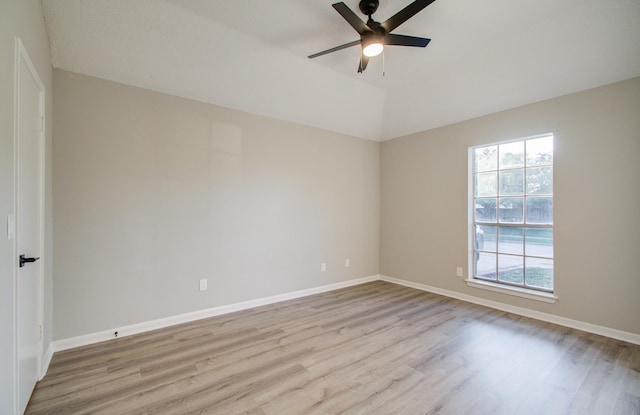 spare room with ceiling fan and light wood-type flooring