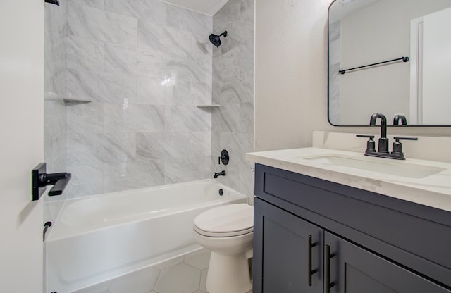 full bathroom featuring tile patterned floors, toilet, vanity, and tiled shower / bath