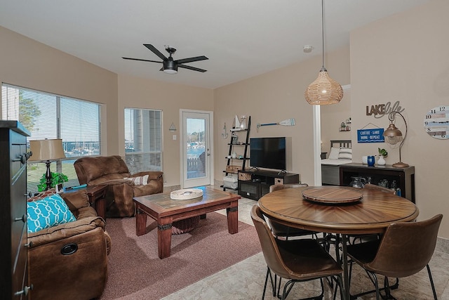 carpeted living room featuring ceiling fan