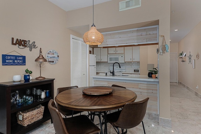 dining space with sink