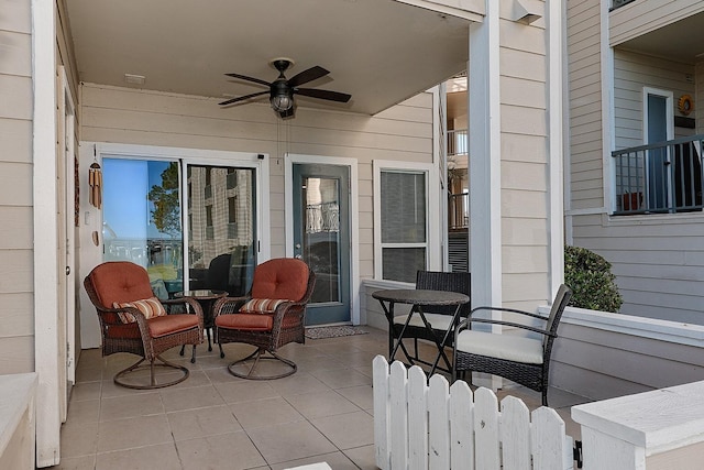 view of patio featuring ceiling fan