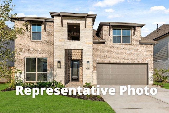 view of front of house featuring a front yard and a garage