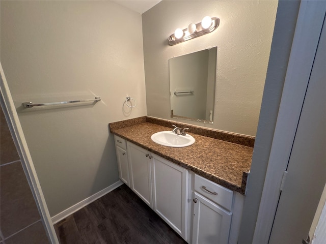 bathroom with vanity and hardwood / wood-style flooring