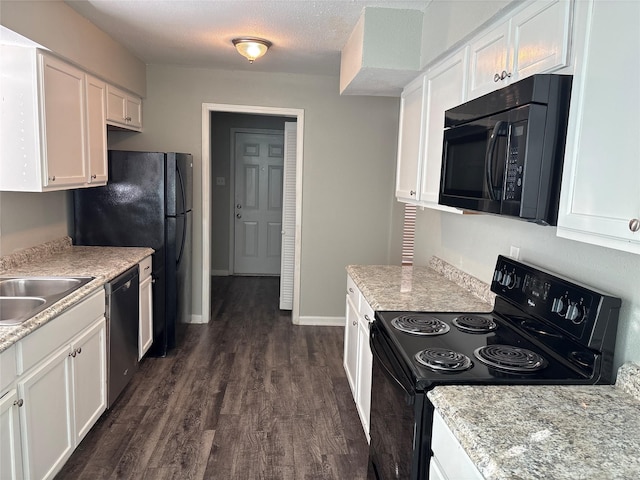 kitchen with white cabinetry, sink, dark hardwood / wood-style flooring, a textured ceiling, and black appliances