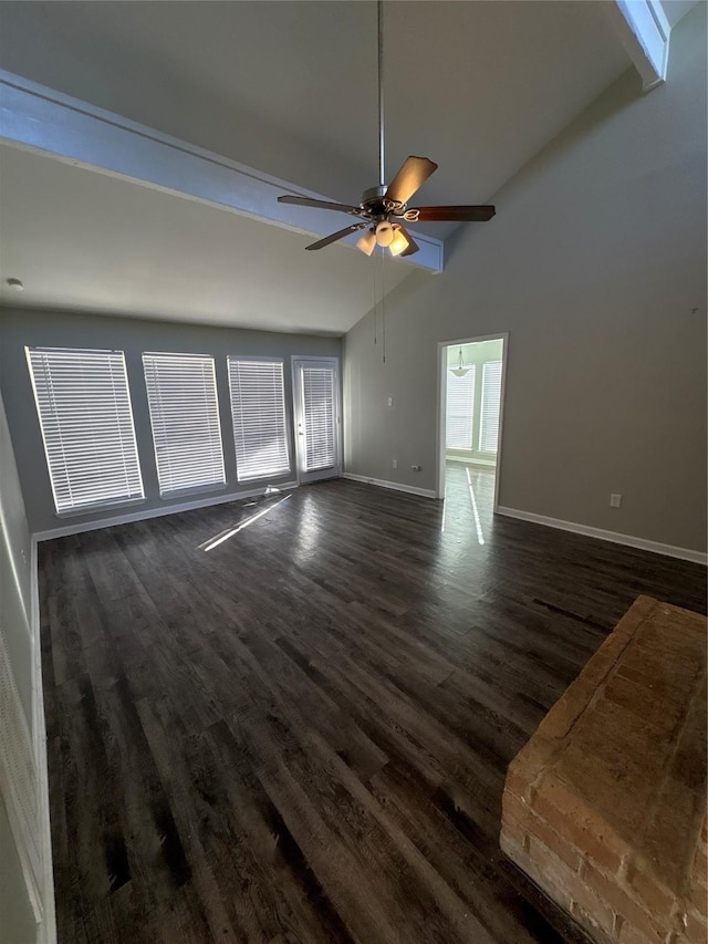 unfurnished living room with ceiling fan, beamed ceiling, dark hardwood / wood-style floors, and high vaulted ceiling