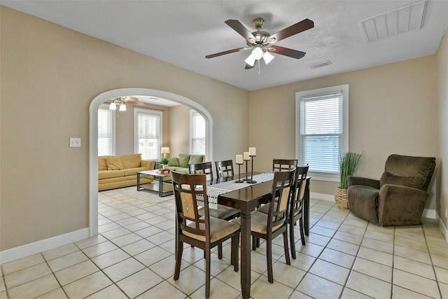 dining space featuring ceiling fan, plenty of natural light, and light tile patterned floors