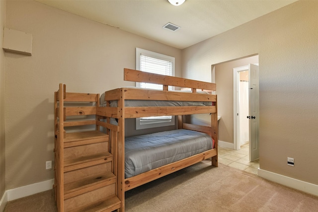 bedroom with light colored carpet