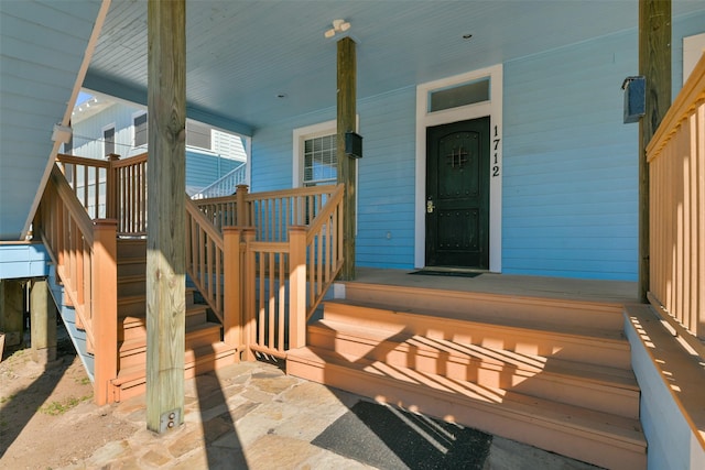 property entrance with covered porch