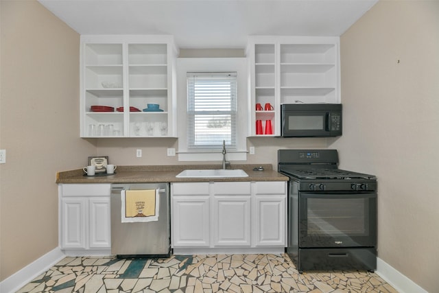 kitchen featuring sink, white cabinets, black appliances, and light tile patterned floors