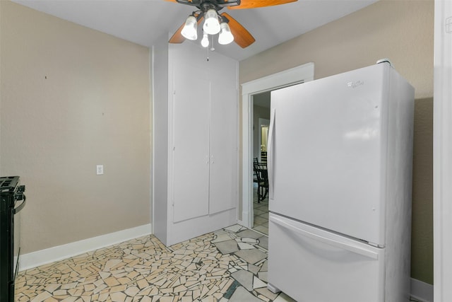 kitchen featuring electric range, ceiling fan, white fridge, and light tile patterned floors