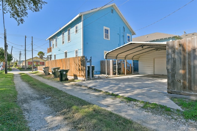 rear view of house featuring a carport