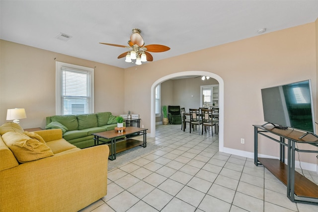 tiled living room featuring ceiling fan