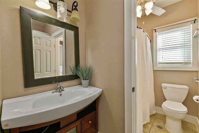 bathroom featuring ceiling fan, curtained shower, tile patterned floors, toilet, and vanity