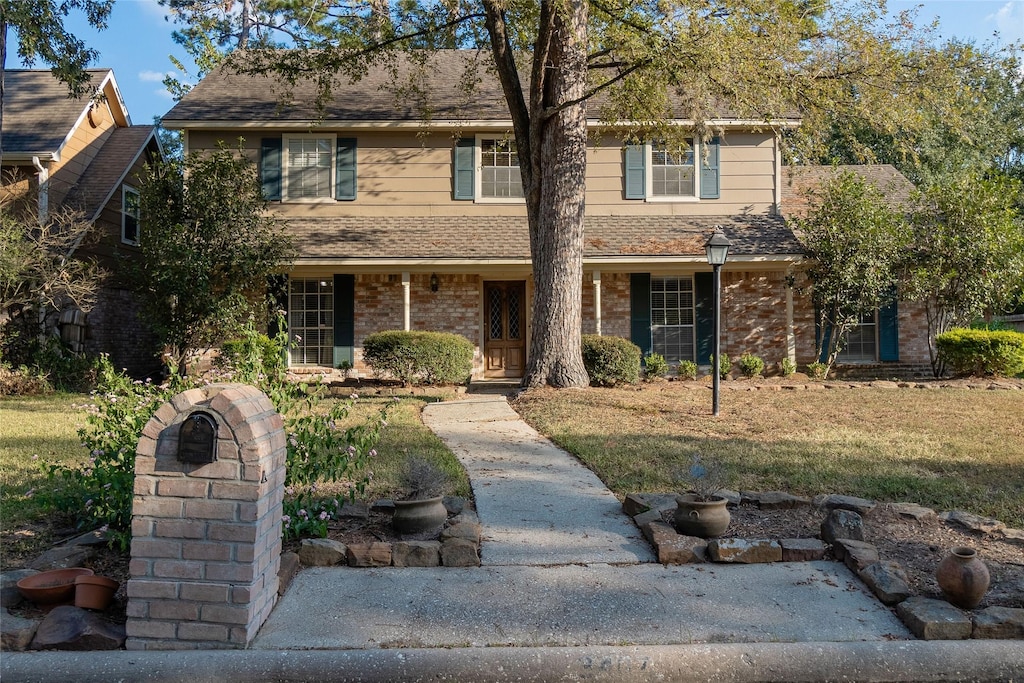 view of property with a front lawn