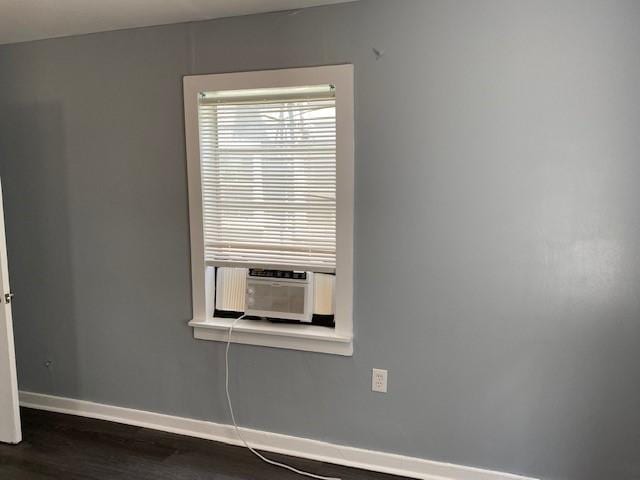 empty room with dark hardwood / wood-style floors and cooling unit