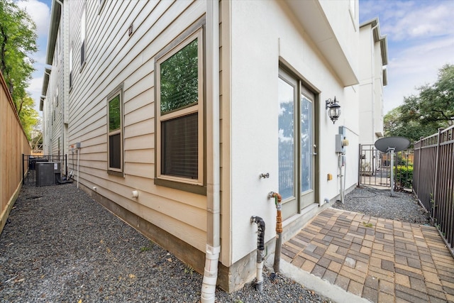 view of home's exterior with central AC unit