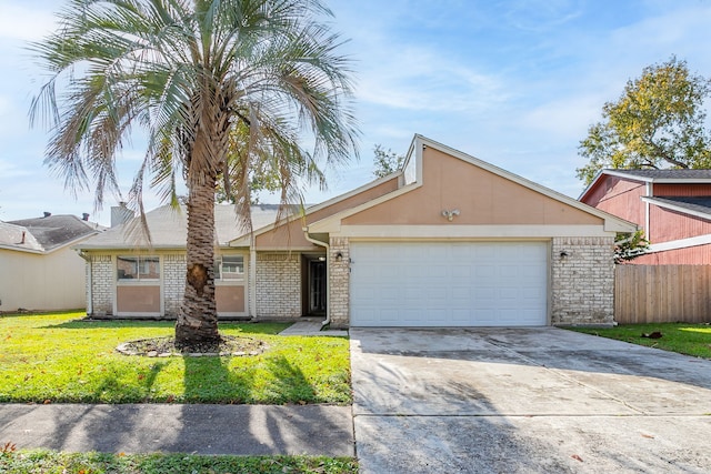 single story home featuring a front yard and a garage