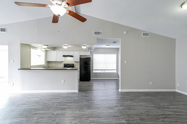 unfurnished living room with dark hardwood / wood-style flooring, high vaulted ceiling, and ceiling fan