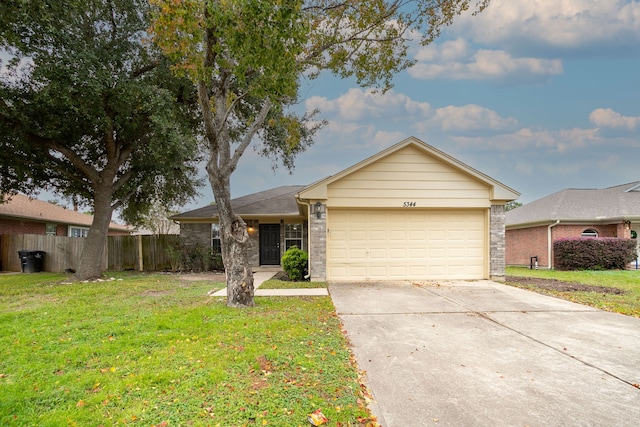 ranch-style house with a garage and a front lawn