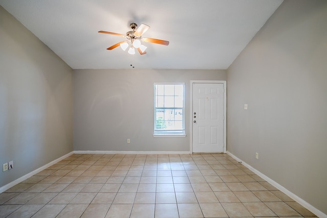 interior space with ceiling fan