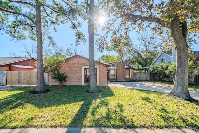 ranch-style home featuring a patio and a front yard