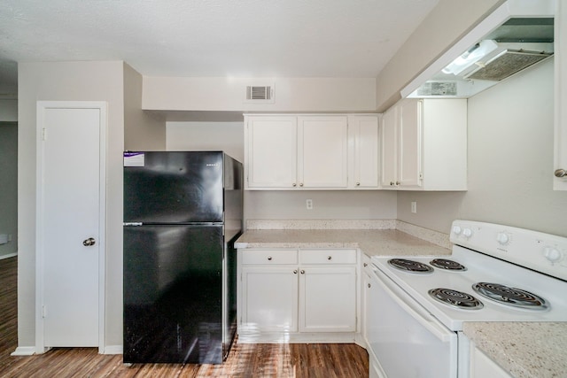 kitchen featuring black refrigerator, white cabinets, light wood-type flooring, and white electric range