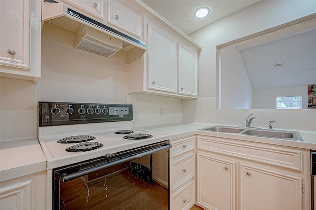 kitchen featuring white cabinets, a textured ceiling, white range with electric stovetop, and sink