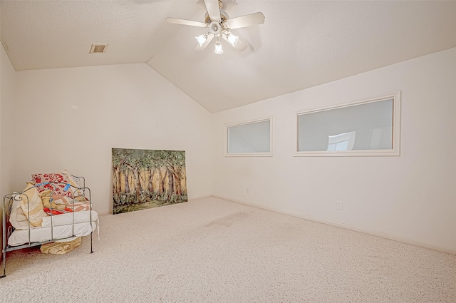 living area with carpet flooring, ceiling fan, and lofted ceiling