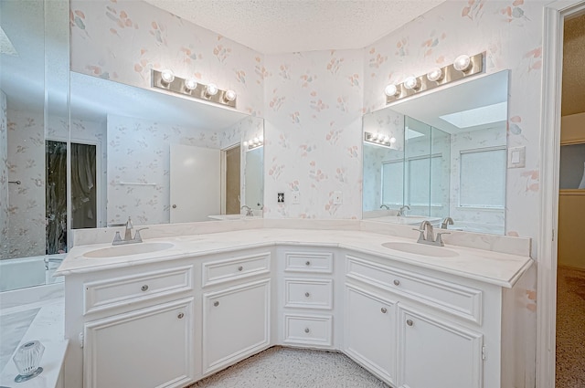 bathroom with vanity and a textured ceiling