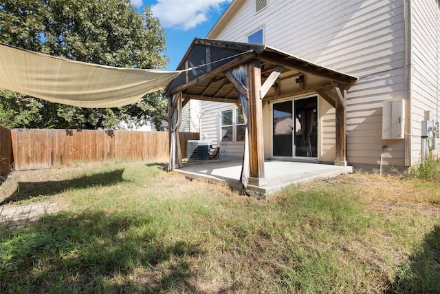 exterior space with central AC, a yard, and a patio