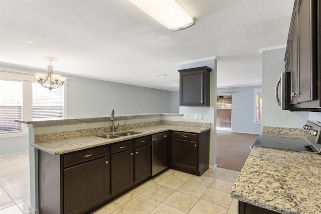 kitchen with sink, an inviting chandelier, a healthy amount of sunlight, and appliances with stainless steel finishes