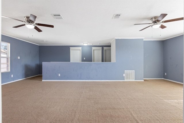 unfurnished room featuring carpet flooring, ceiling fan, and ornamental molding