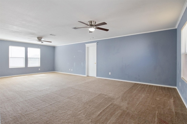 unfurnished room featuring ceiling fan, carpet floors, and ornamental molding